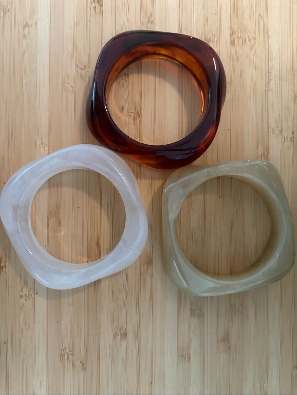 Source Unknown Resin Bracelets in Amber, Ivory, and Olive